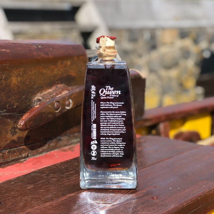 The back of the bottle of the new Tres Hombres Captain's Choice Rum "The Queen". A 23 year-old rum from La Palma, distillery Aldea, transported by engineless sailing vessel Tres Hombres. On the back is written the story of this rum.